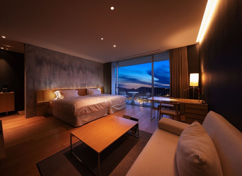 Garden Terrace Nagasaki Hotels & Resorts room with twin beds and balcony view over Nagasaki