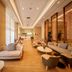 Guanyuan Liusu Hotel in Suzhou lobby lounge with sofas, chairs, and tall windows