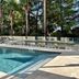 Logis Hôtel de Port d'Alon, Saint-Cyr-sur-Mer: outdoor pool beside palm trees and lounge chairs
