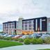 Home2 Suites by Hilton Idaho Falls exterior with parking lot and landscaped entrance