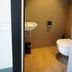 Zandpaviljoen Pier 7 in Vlissingen bathroom with wall-mounted sink and toilet