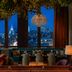 Moxy NYC Lower East Side lounge with skyline views over New York at night