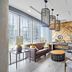 Placemakr Premier Sobro lobby lounge in Nashville with city views, leather sofa, and modern seating
