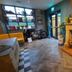 The Stag Rooms, Alcester lounge with fireplace, motorcycle display and large window seating