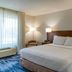 Fairfield Inn by Marriott Salt Lake City Layton guest room with king bed, lamps, and window seating