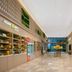 Home2 Suites by Hilton Xishuangbanna Jinghong lobby with market shelves and glass doors to outdoor view