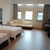 Bo Xuan Hotel (Beijing Yungang Nangong) room in Beijing with two beds, sofa and large windows