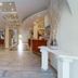 Diana Palace Hotel Zakynthos lobby in Argassi with curved reception desk and spacious tiled interior