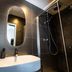 Hôtel Paulette Rouen Centre Cathédrale bathroom with modern sink, mirror, and glass shower