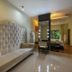 El Dorado Seaside Palms, All & More Inclusive - Adults Only room with tufted sofa and bed, Kantenah Bay