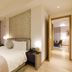 The Clouds Apartment in Shenzhen bedroom with large window seat and view of city lights