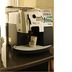 Hotel Shin-ei in Toyota coffee machine with disposable cup on a counter