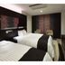 Jr-East Hotel Mets Nagaoka guest room with two twin beds in Nagaoka