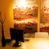 Justbeds Bangkok reception desk with computer and abstract floral wall art