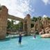 The Cabanas Hotel at Sun City Resort tropical pool with rock waterfall and rope bridge