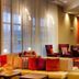 Courtyard by Marriott Syracuse Downtown at Armory Square lobby lounge with colorful seating and TV