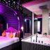 Cupid Hotel in Ho Chi Minh City with neon-lit bedroom, mirrored wall and a jacuzzi bathtub