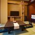 Houraiya in Kamogawa guest room with low table, tatami mats, and raised bed alcove
