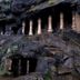 Hotel Pooja International in Nashik, rock-cut facade with carved columns