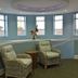 Pelican Beach Resort & Conference Center in Destin lounge with two wicker chairs and windows