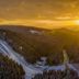 Ferien Appartements Am Berghotel Oberhof in Oberhof with snowy ski jumps at sunset