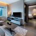 Dao By Dorsett Amtd Singapore living room with city view, sofa, TV, and coffee table
