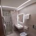 Hotel della Valle, Agrigento bathroom with glass shower, wall-mounted sink, bidet and toilet