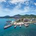Onda D'oro Hostel in Yeosu with harbor marina, boats, and coastal mountain views