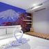 The Aim Patong Hotel in Patong room with Mount Fuji mural, white bed and floral accent seating