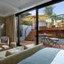 Miiro Borneta Barcelona suite with terrace access, patio seating and stairs to a sunlit outdoor area