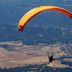 Paraglider over the valley at Albergue Rural Cal Picarol in Àger