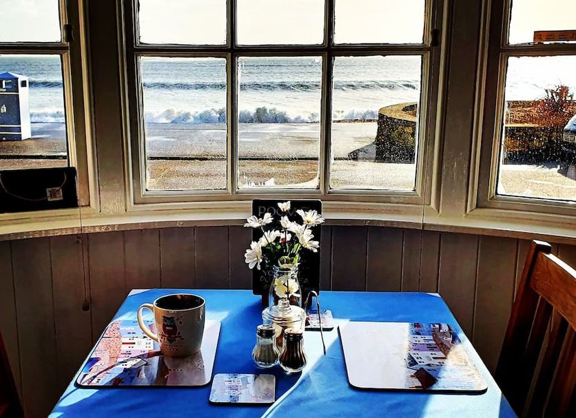 Lyndale Guest House in Weymouth dining area with sea view through large bay windows