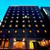 Garner Hotel Kyoto Shijo Karasuma By IHG in Kyoto, tall modern building at night with lit windows.