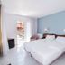 Hotel Plaça in Sant Feliu de Guíxols guest room with twin bed and balcony door
