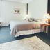 Valley Craft Ales Wilmington guest room with two beds, window light, and bedside lamps