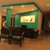 Hotel Santa Maria Praia lobby reception desk with teal accent wall and seating area