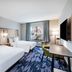 Fairfield by Marriott Inn & Suites Aberdeen, SD guest room with two beds, desk, TV and window view