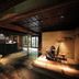 Yuzuya Ryokan Kyoto interior with a reception desk, seating area, and traditional Japanese decor