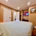 Cozy Home Near Transit & Hillcrest Mall in Richmond Hill bedroom with TV and closet