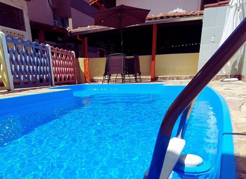 Pousada Gaivotas de Maranduba in Ubatuba with a small outdoor pool and patio seating