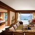Mandarin Oriental, Sanya living room with ocean view, sofa seating, and balcony-facing windows