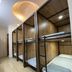 Funny Guesthouse, Ho Chi Minh City: wooden bunk beds in a shared dorm room with ceiling light