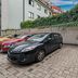 7Days B&B Bratislava parking area with parked cars beside ivy-covered brick walls