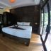 Lipe Sunset Beach Resort room in Ko Lipe with king bed and floor-to-ceiling windows