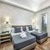 B&B Lorenzo de' Medici Florence twin room with two single beds and herringbone wood-style flooring