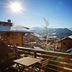 Hotel Bristol Verbier in Bagnes with sunny mountain and chalet rooftop views