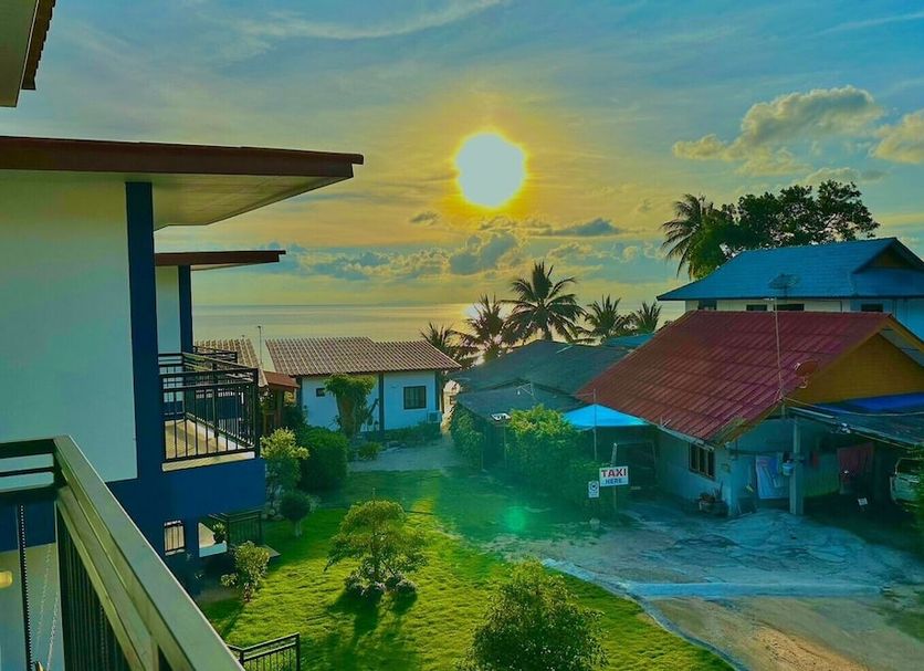 The Scenery Beach Resort in Ko Pha Ngan with sunset ocean view and tropical rooftops