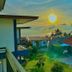 The Scenery Beach Resort in Ko Pha Ngan with sunset ocean view and tropical rooftops