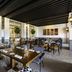 Fairmont La Marina Rabat-Salé in Rabat dining room with set tables, patterned floor, and black slatted ceiling