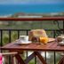 Kaliviani Traditional Hotel in Kissamos balcony breakfast table with sea view and coffee
